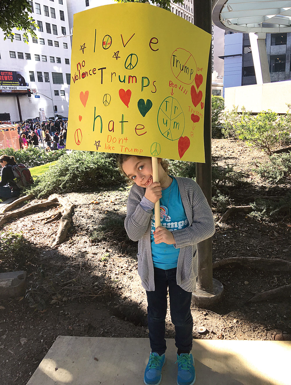 Maisy Myers, 7, of Porter Ranch, was among the young participants hoisting their signs at the march. Photo by Beth Meyers