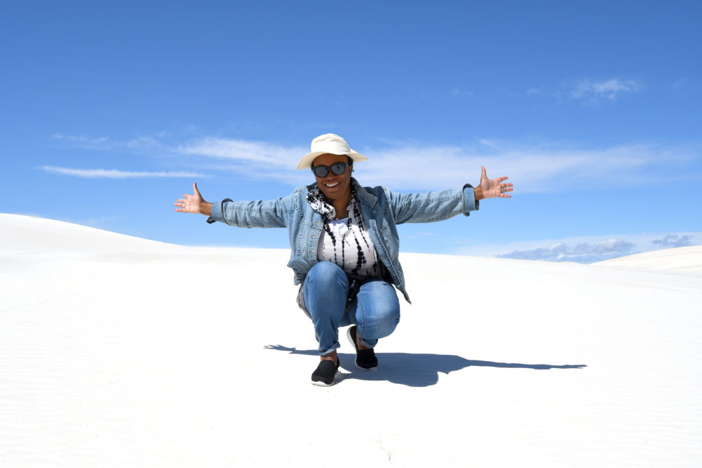 Radio Travel Talk Show Host Annita Thomas enjoys a big moment at White Sands National Monument.