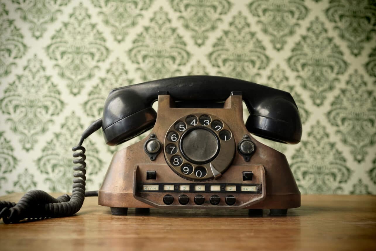 Old telephone made of copper - stock photo / GettyImages