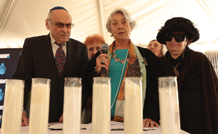 From left: Hungarian Holocaust survivors Steve Kovary, Eva Nathanson and Eva Brettler light memorial candles at this year’s community Yom HaShoah ceremony. This year marked the 80th anniversary of the deportation of Hungarian Jews to Auschwitz. Photo by Al Seib, Holocaust Museum LA